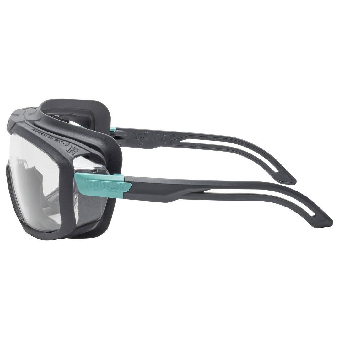 Safety glasses with a clear field of vision, robust black frame and green accents, suitable for use in high-impact work.