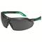 Black safety glasses with tinted lenses and green accents. 'Uvex' brand name printed on the side.