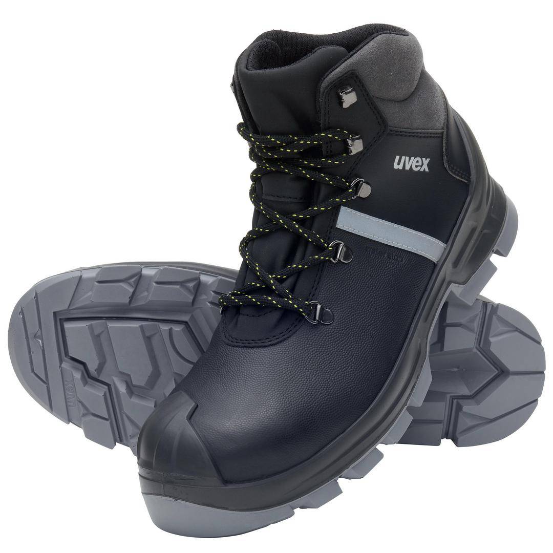 Black safety boots with grey rubber sole, padded ankles and distinctive lace-up design, suitable for demanding work environments.