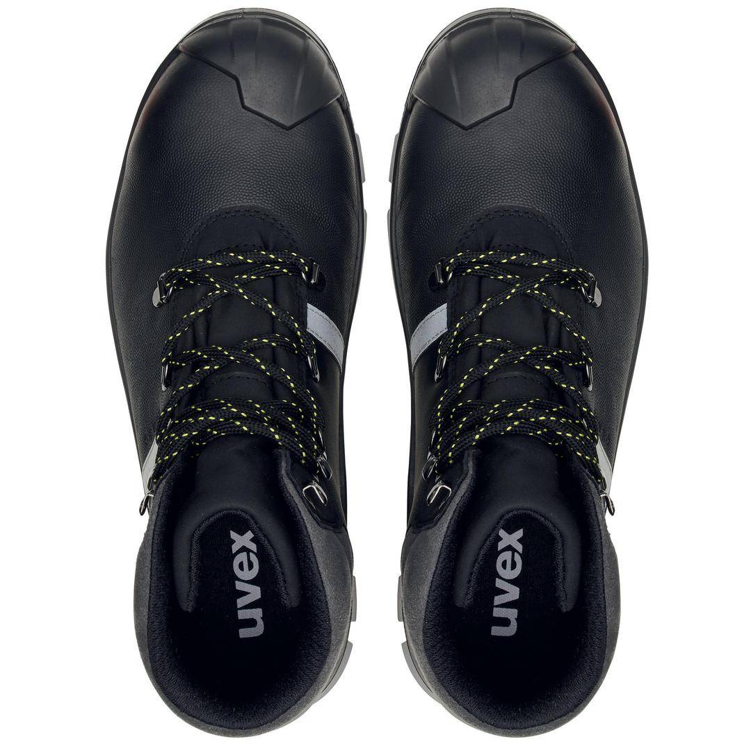 Black safety boots with yellow and black lace, viewed from above. 'Uvex' brand name visible on insoles.