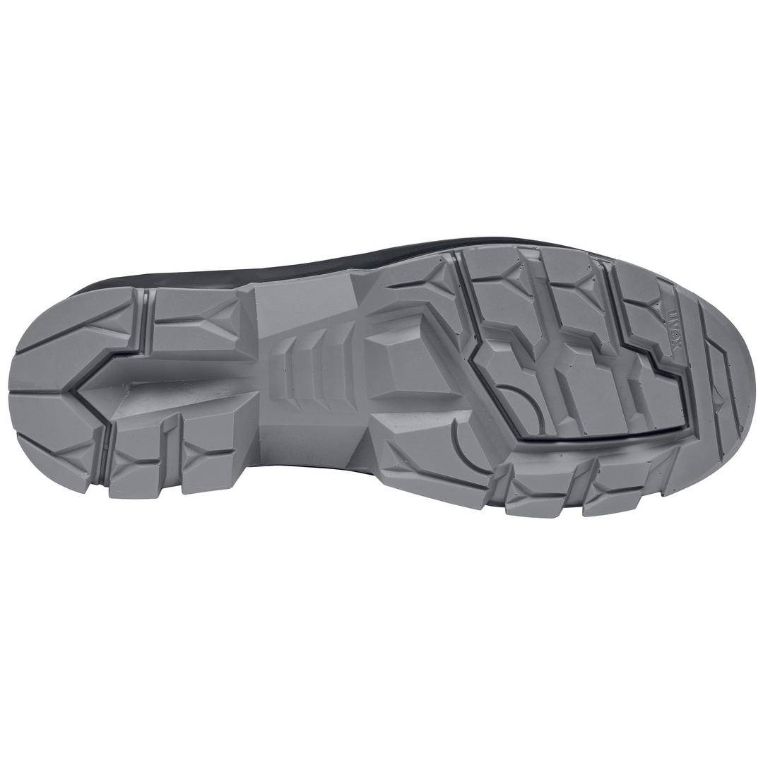 The underside of a grey shoe with a treaded sole, suitable for outdoor activities.