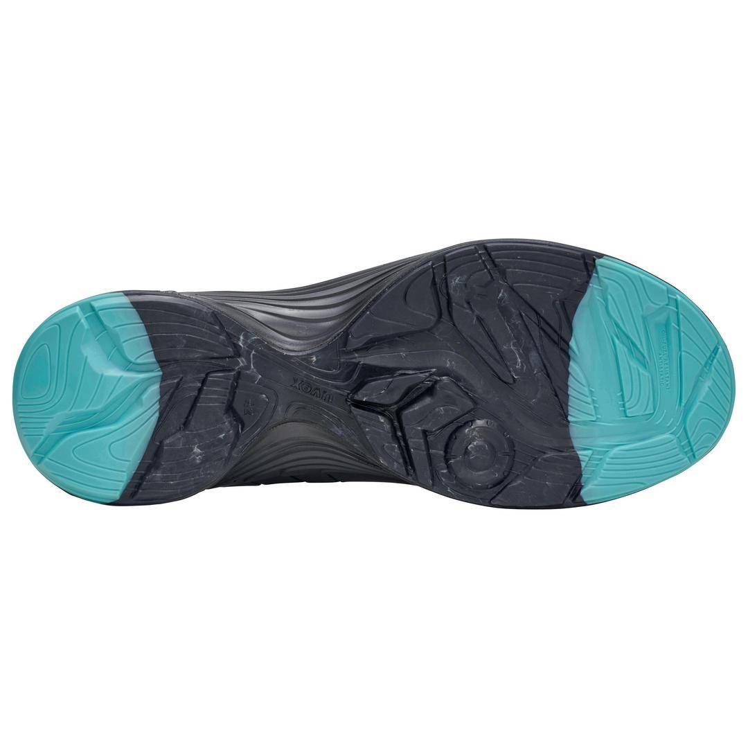 The sole of a sports shoe with a distinctive pattern and predominantly black colour, with the toe and heel in turquoise.