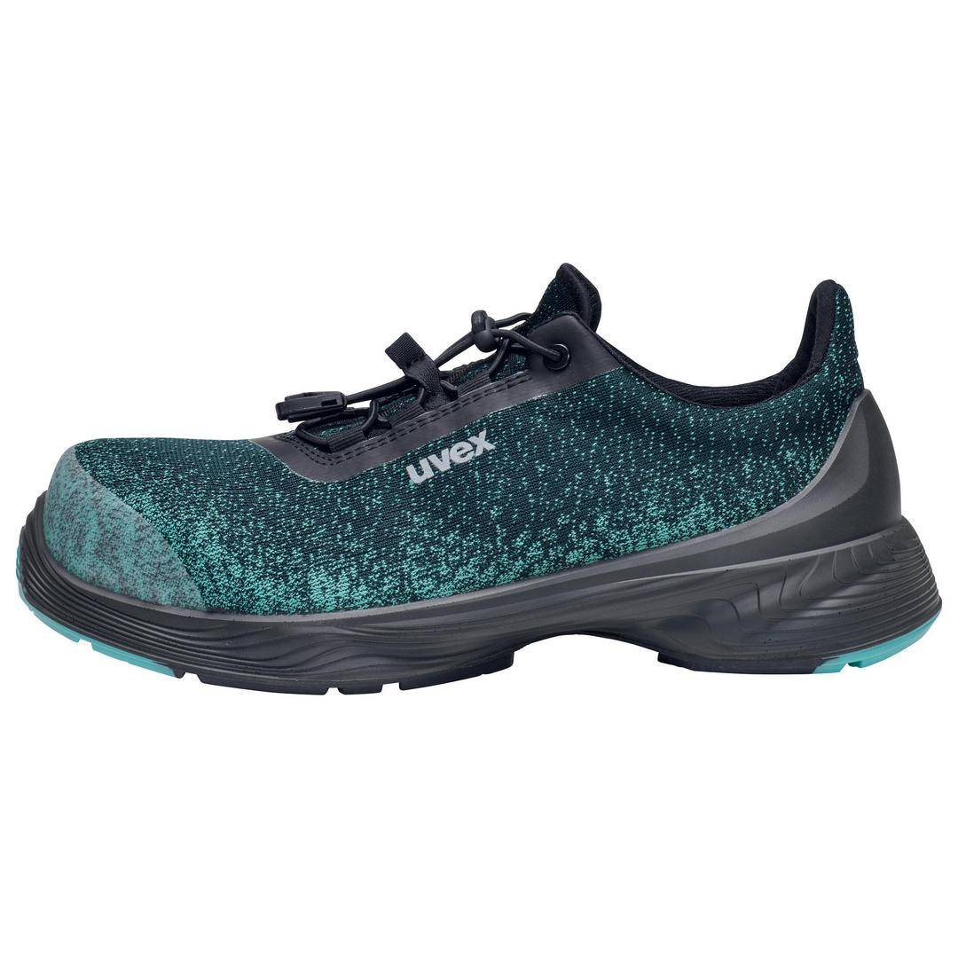 A dark green safety shoe with black accents and a non-slip sole. The shoe features a robust toe cap and quick-release fastening.