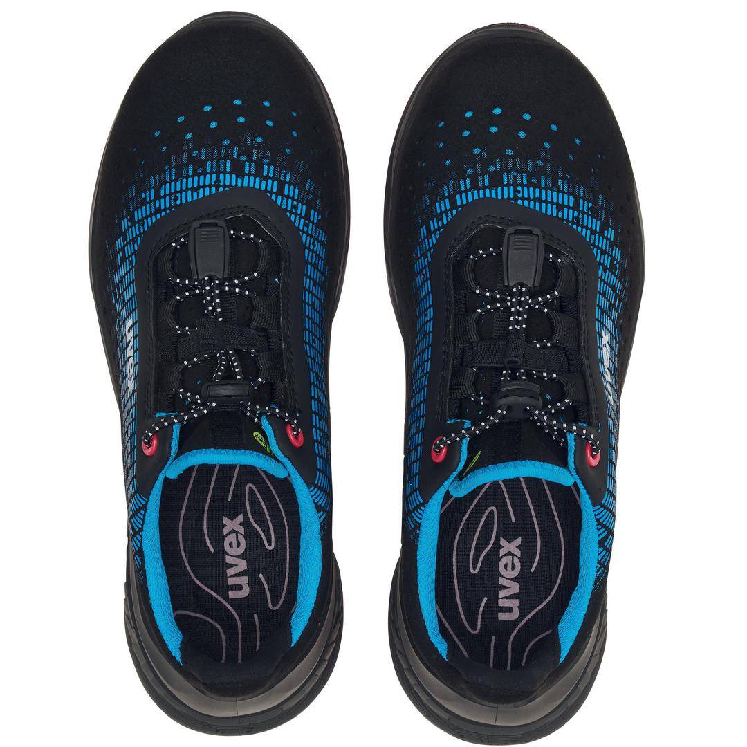 A pair of black shoes with a blue pattern, viewed from above. They have a UVEX logo on the inner sole.
