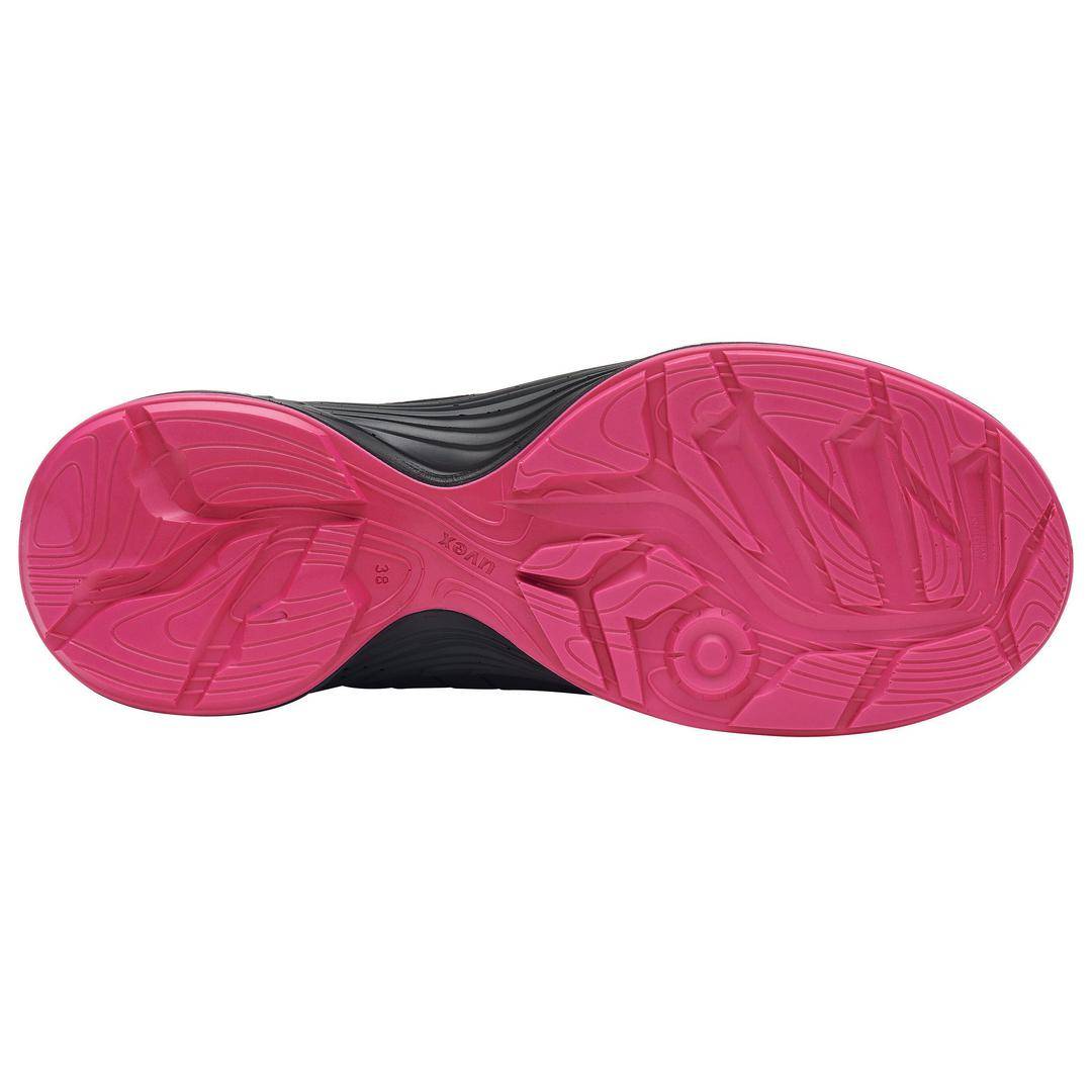 Shoe sole with a pink, textured tread pattern to improve grip and stability.