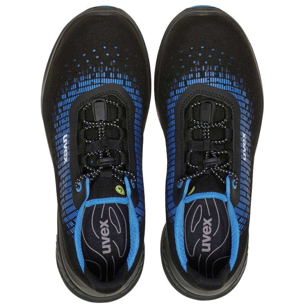 Black and blue sports trainers viewed from above. The trainers have a distinctive pattern on the upper section and laces.