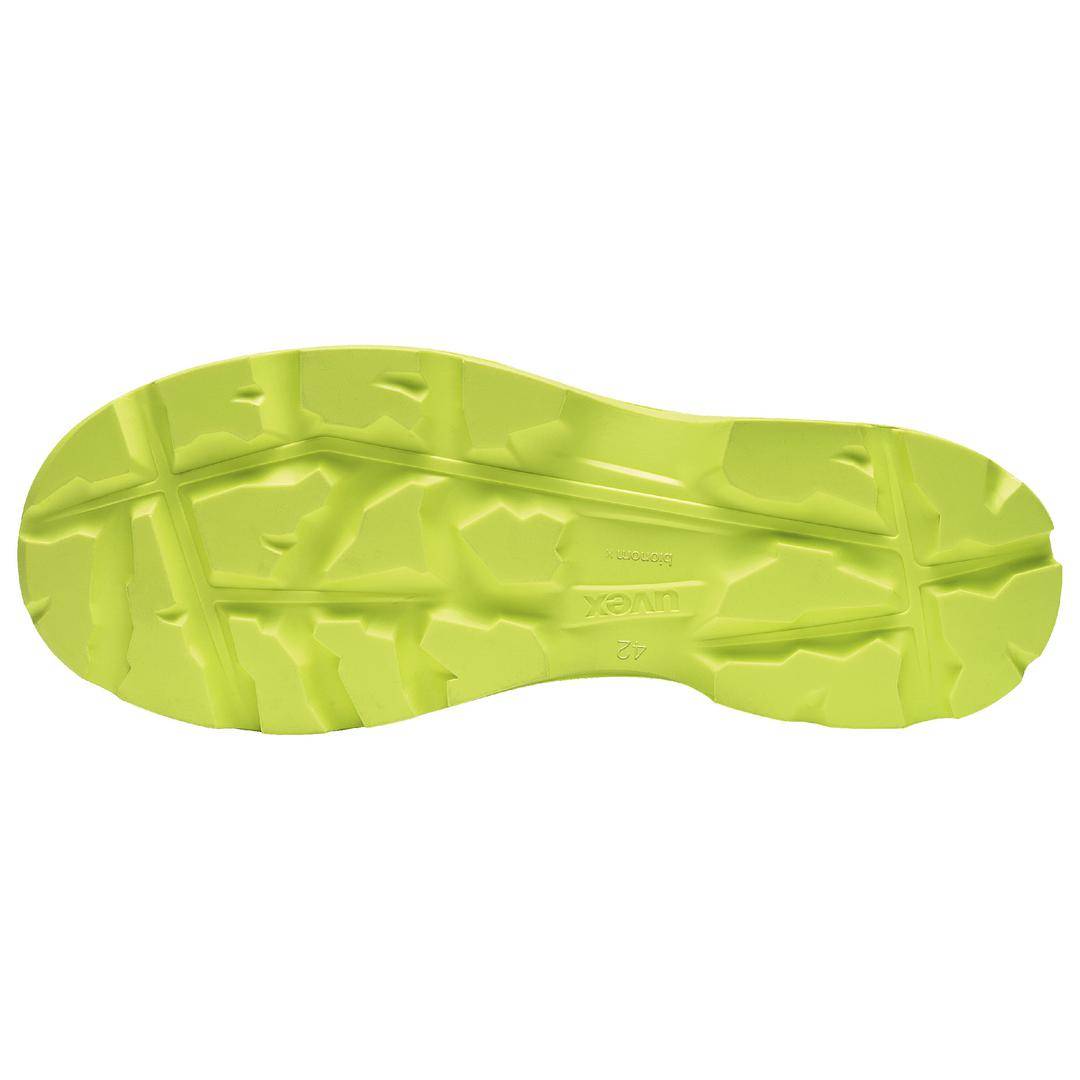 Yellow shoe sole with a coarse tread, suitable for rugged terrain and providing good grip.