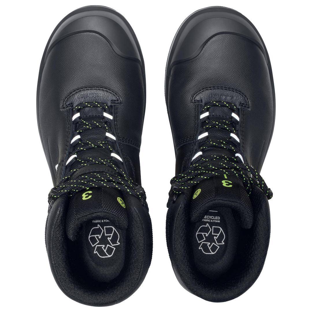 A pair of black work shoes with lace-up fastenings, recycled inner lining, and a recycling symbol on the inner sole.