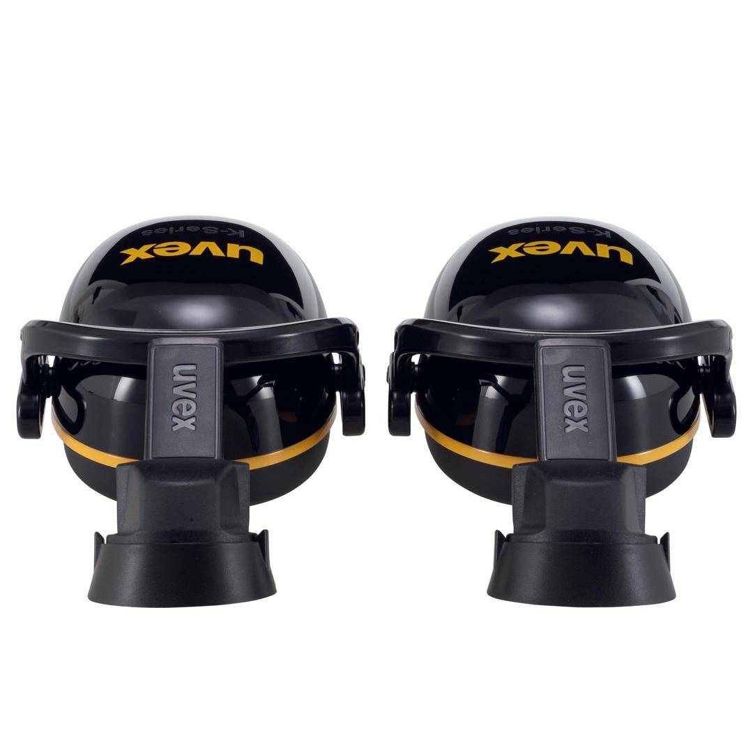 Two black hearing protection headphones by Uvex, positioned with the ear cups facing upwards, on a white background.