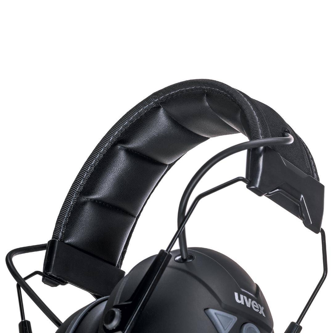Black ear defenders with padded headband and adjustable ear cups. 'uvex' brand visible on the outer side.