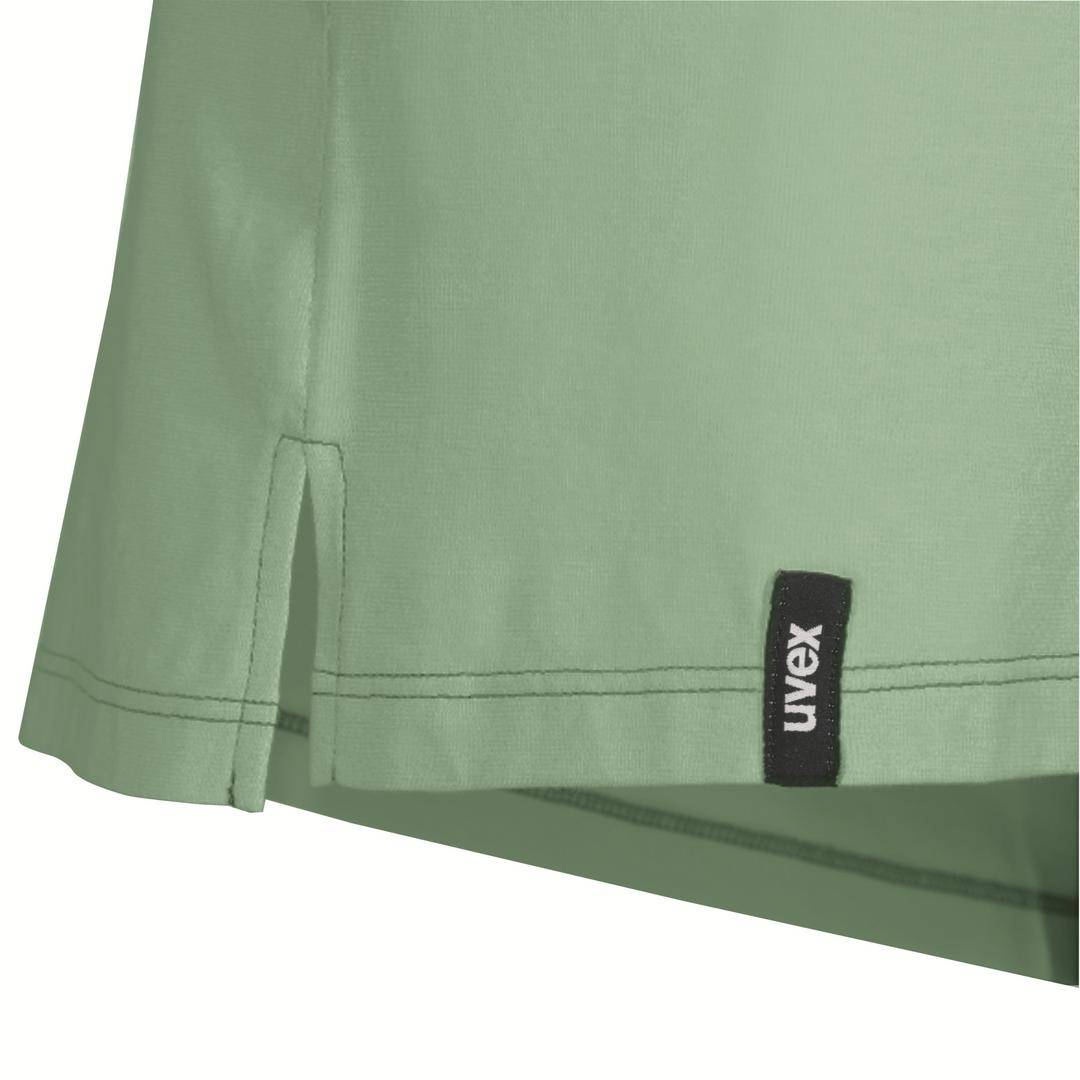 Green garment with a black label bearing the inscription 'Uvex'.