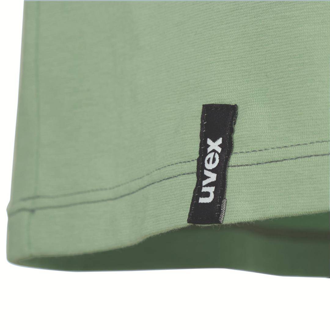 Green garment with a black label on the side that reads 'uvex'.