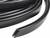 Black, flexible rubber seal in a U-shape, used for sealing edges or joints, commonly found in automobiles or machinery.