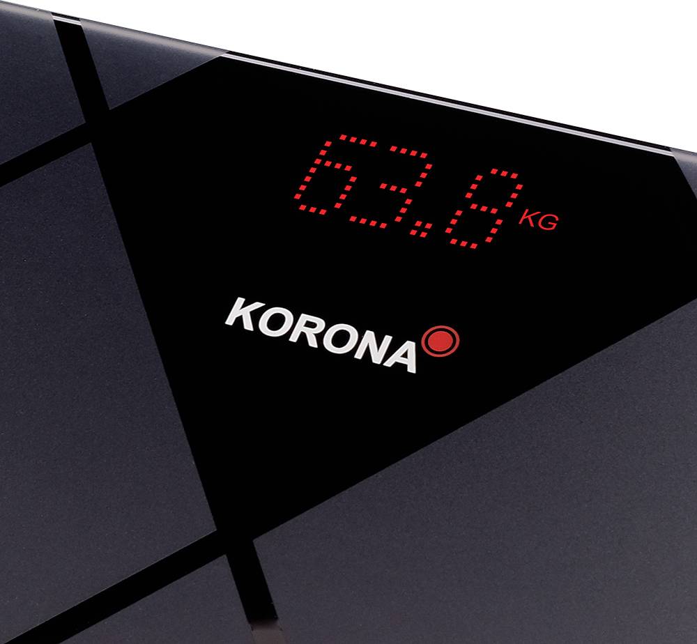 A digital bathroom scales shows a weight of 63.8 kg.