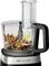 Food processor with 850 W. Container contains almonds and walnuts being chopped. Green arrows indicate chopping motion.