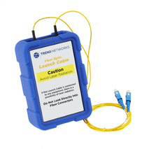 Device for optical fibre cable testing with a yellow label warning against laser radiation. Two blue connectors are connected to the cable.