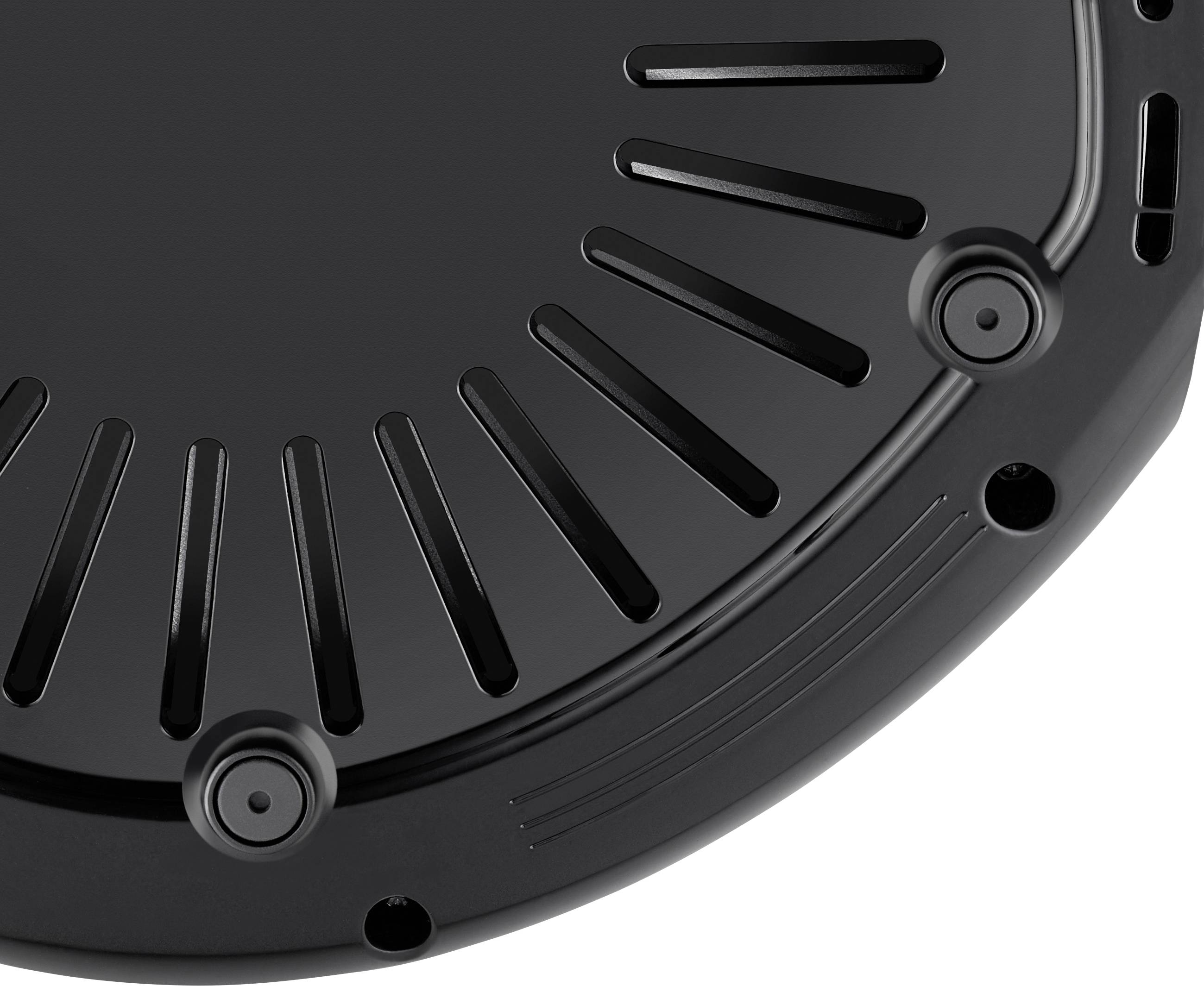 Black round object with multiple screw holes and slots around the edge, possibly part of a housing or lid.