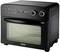 A black UNOLD hot air oven with a digital display, temperature showing 230 degrees, and two rotary controls.