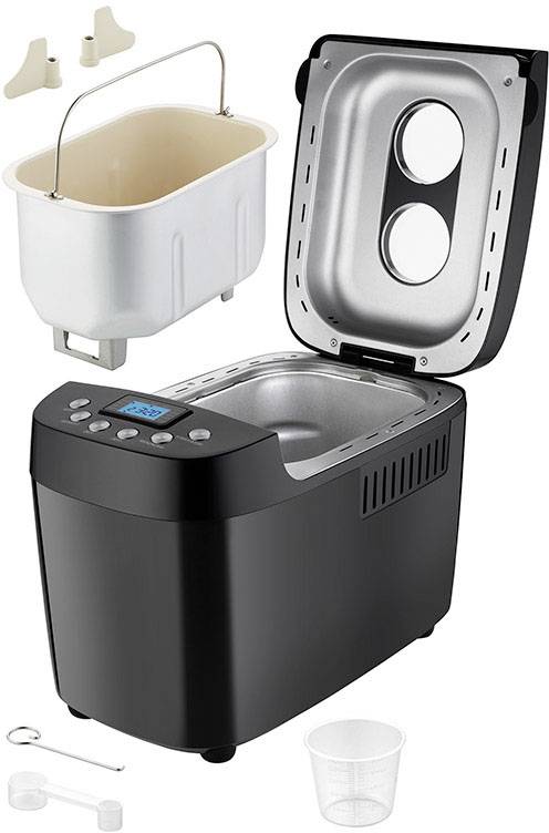Black bread maker with open lid, removable baking pan, display and accessories such as measuring cup and hook.