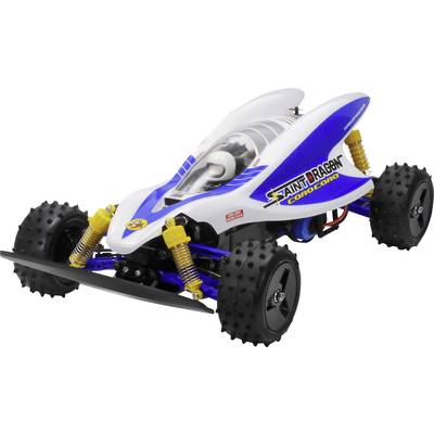 A white and blue remote-controlled racing car model with large, studded tyres, yellow shock absorbers, and 'Saint Dragon' lettering.