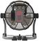 A portable fan with a black grille and grey base, viewed from the front. Suitable for use in workshops or construction sites.