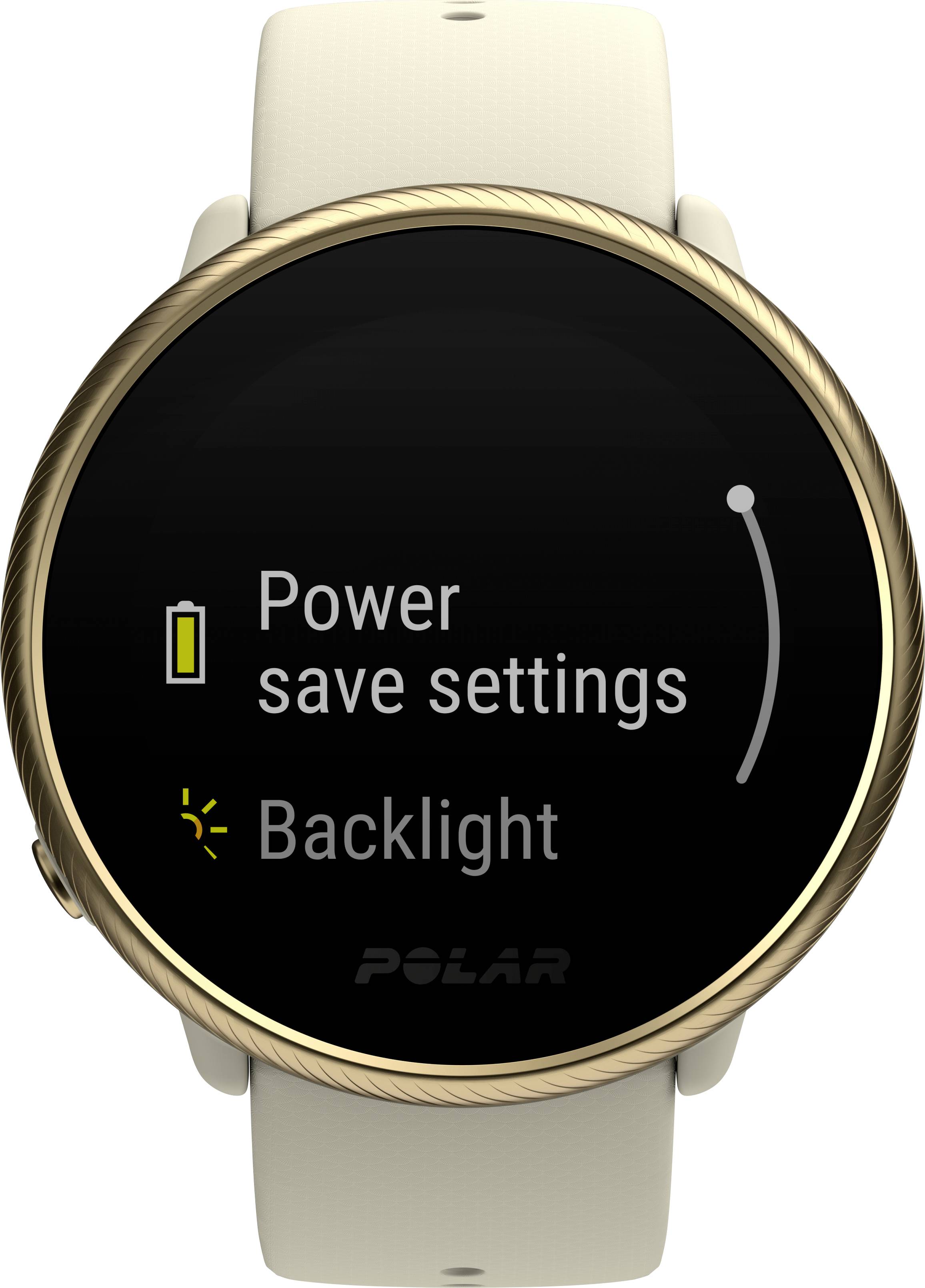 Smartwatch with a round display shows 'Power saving mode' and 'Backlight' with a gold-coloured casing and beige strap.