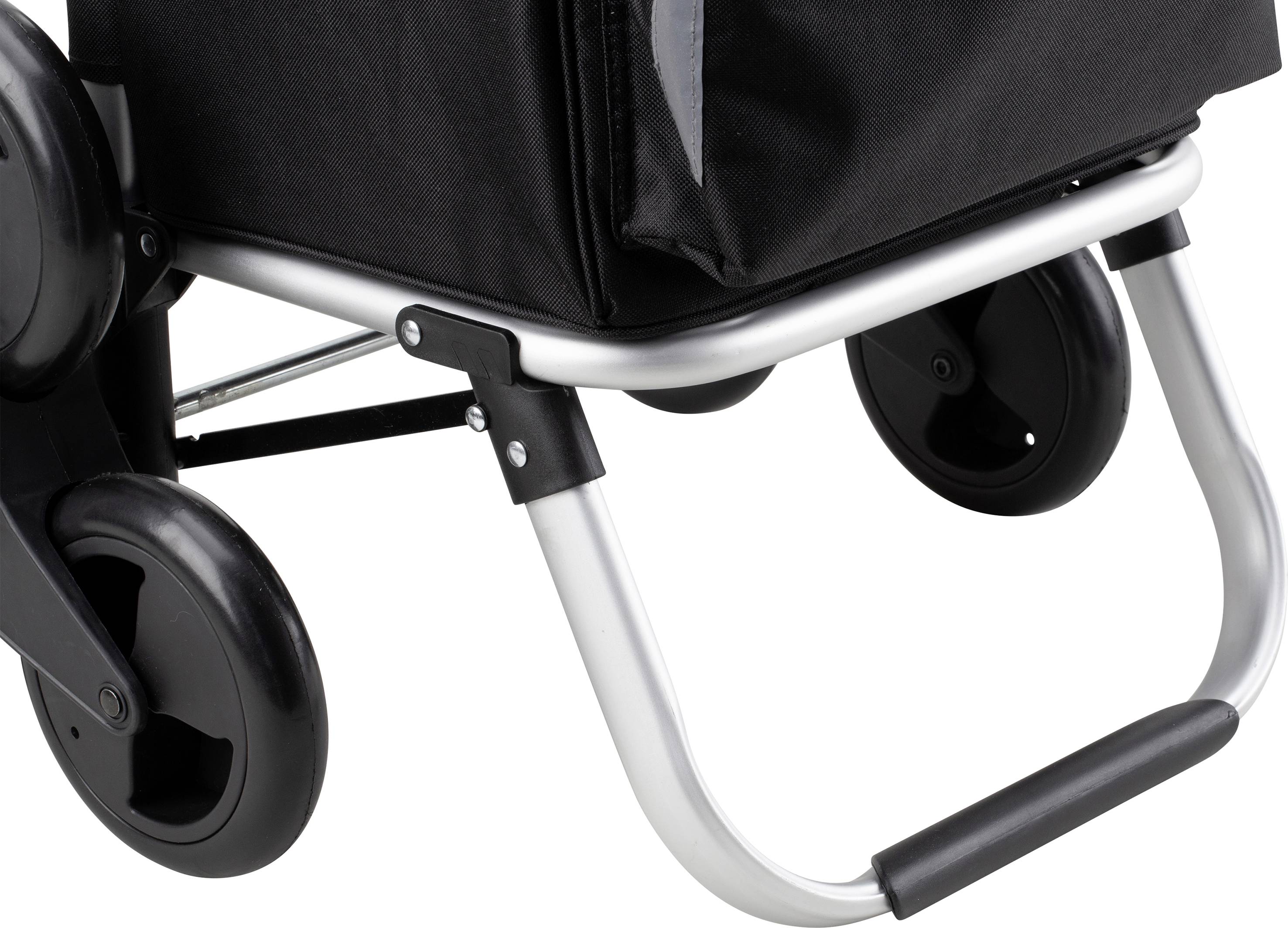 Black wheels and silver frame of a folding shopping trolley on a white background.