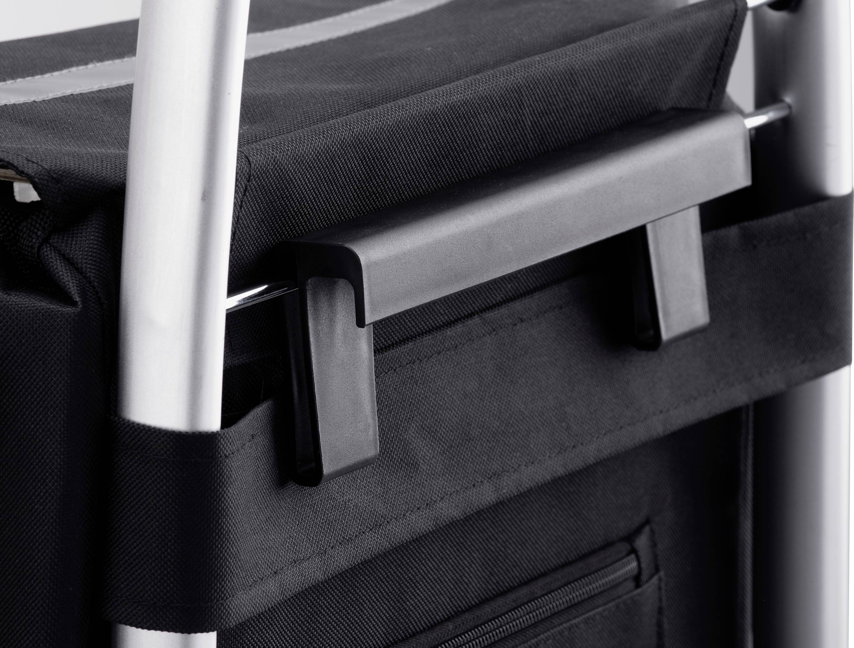 Black bag with a handle on a silver frame. The bag appears to be securely fastened and well-suited for transportation.