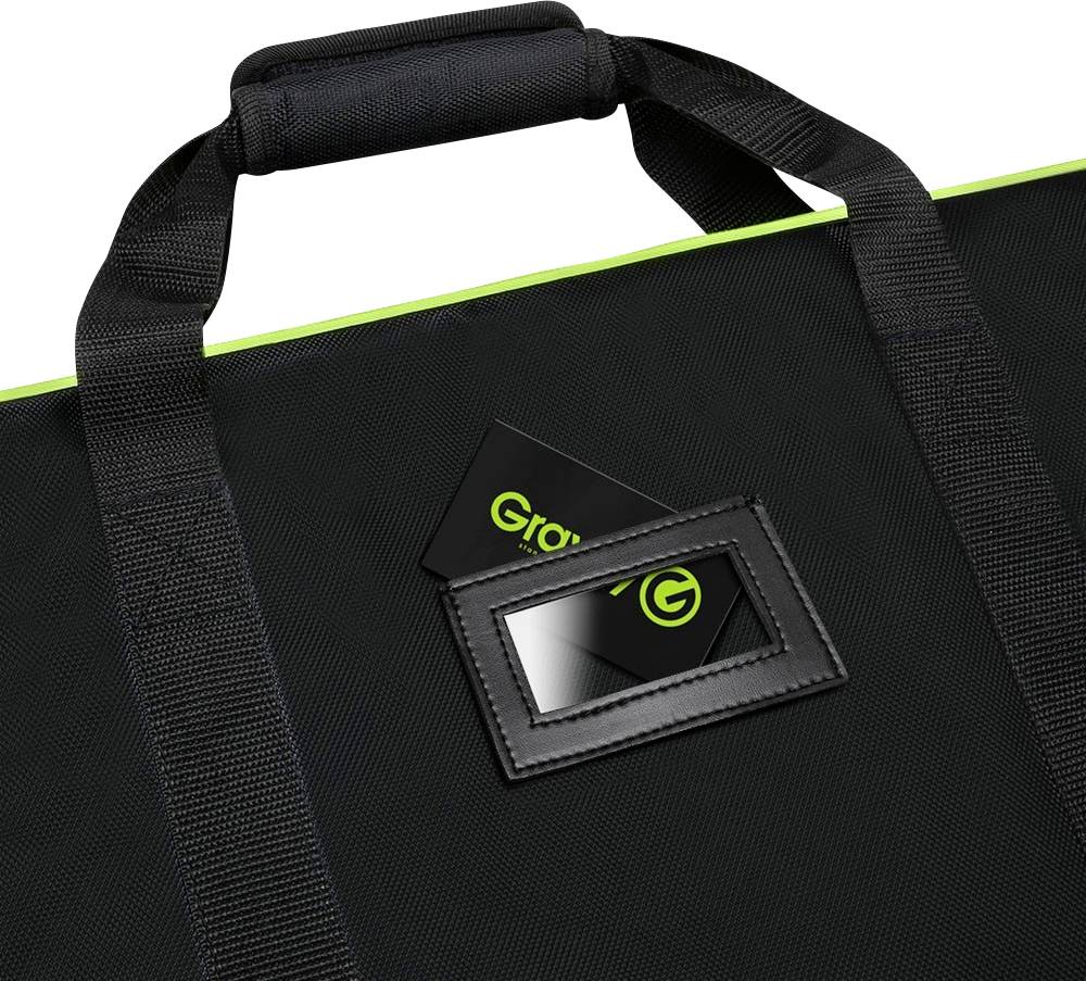 Black tote bag with two handles and a transparent compartment containing two black cards with the green 'Gravity' logo.