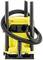 Yellow vacuum cleaner with black hose and accessories, standing upright.