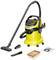 'Yellow wet and dry vacuum cleaner with accessories: floor nozzle, crevice tool, filter and dust bag. Brand names are visible.'