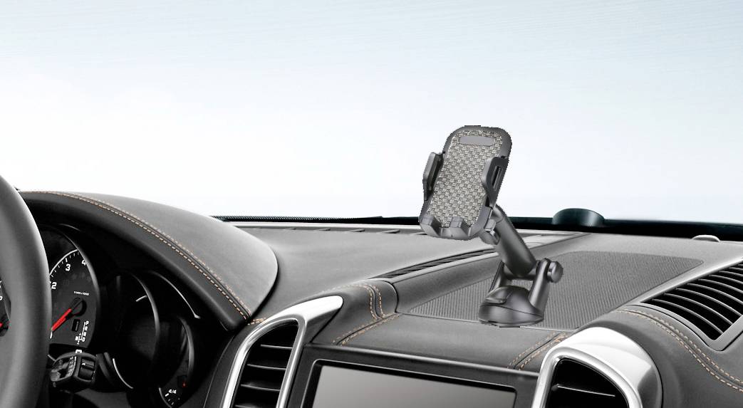 A car phone mount is fitted on the vehicle's dashboard. It has a movable joint and a padded mounting shield.
