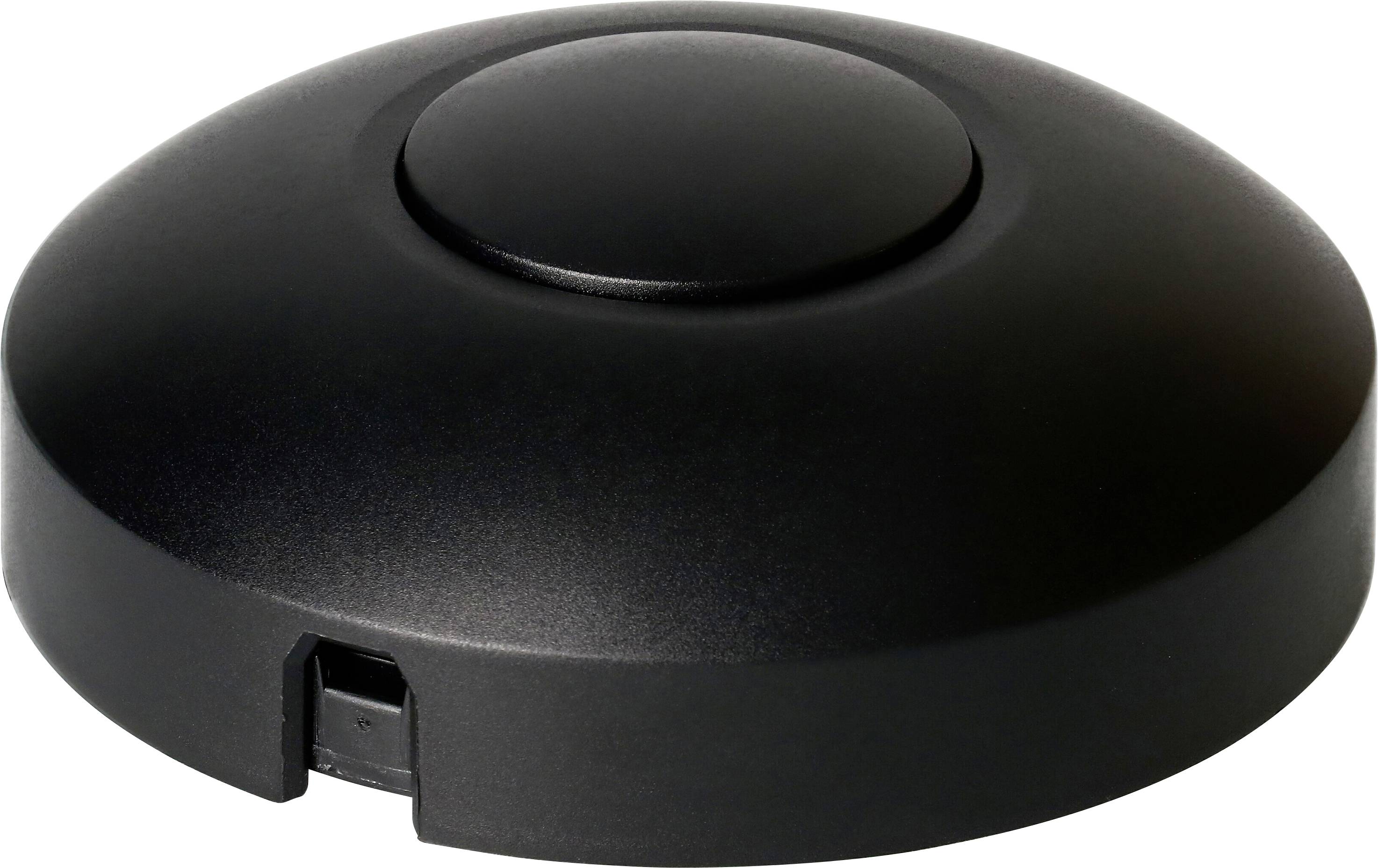 A black, round, flat USB foot switch with a central button. Ideal for controlling functions by foot pressure.