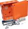 Orange connection box with removable lid; contains screws, clamps, and brackets. Suitable for electrical installations.