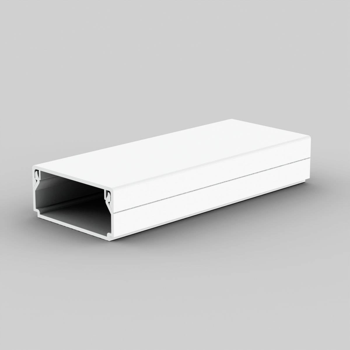 A long, rectangular cable trunking made of white plastic, open at one end, is resting on a grey surface.