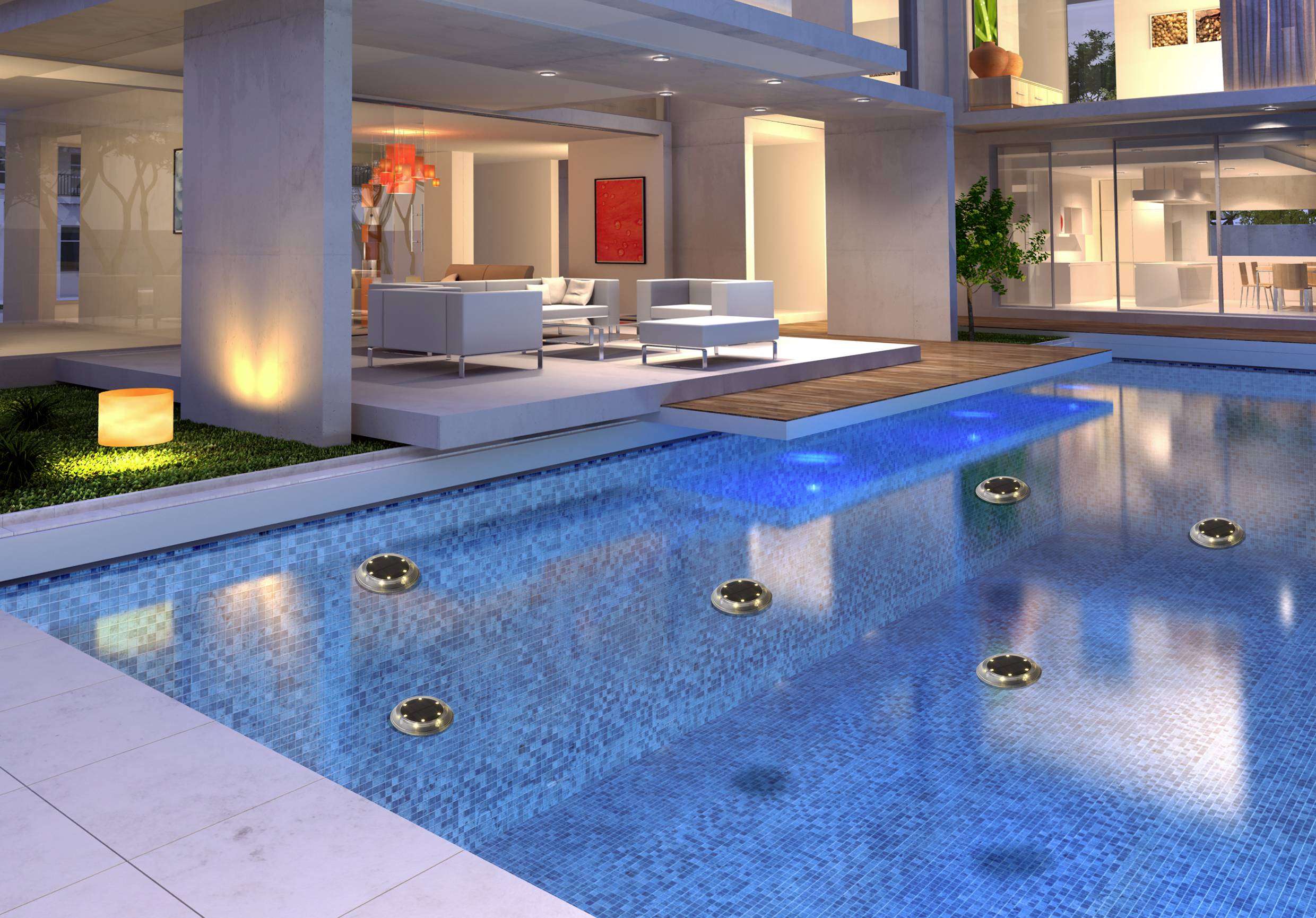 A modern house with an illuminated swimming pool at night. Terrace with stylish furniture and glass façade in the background.