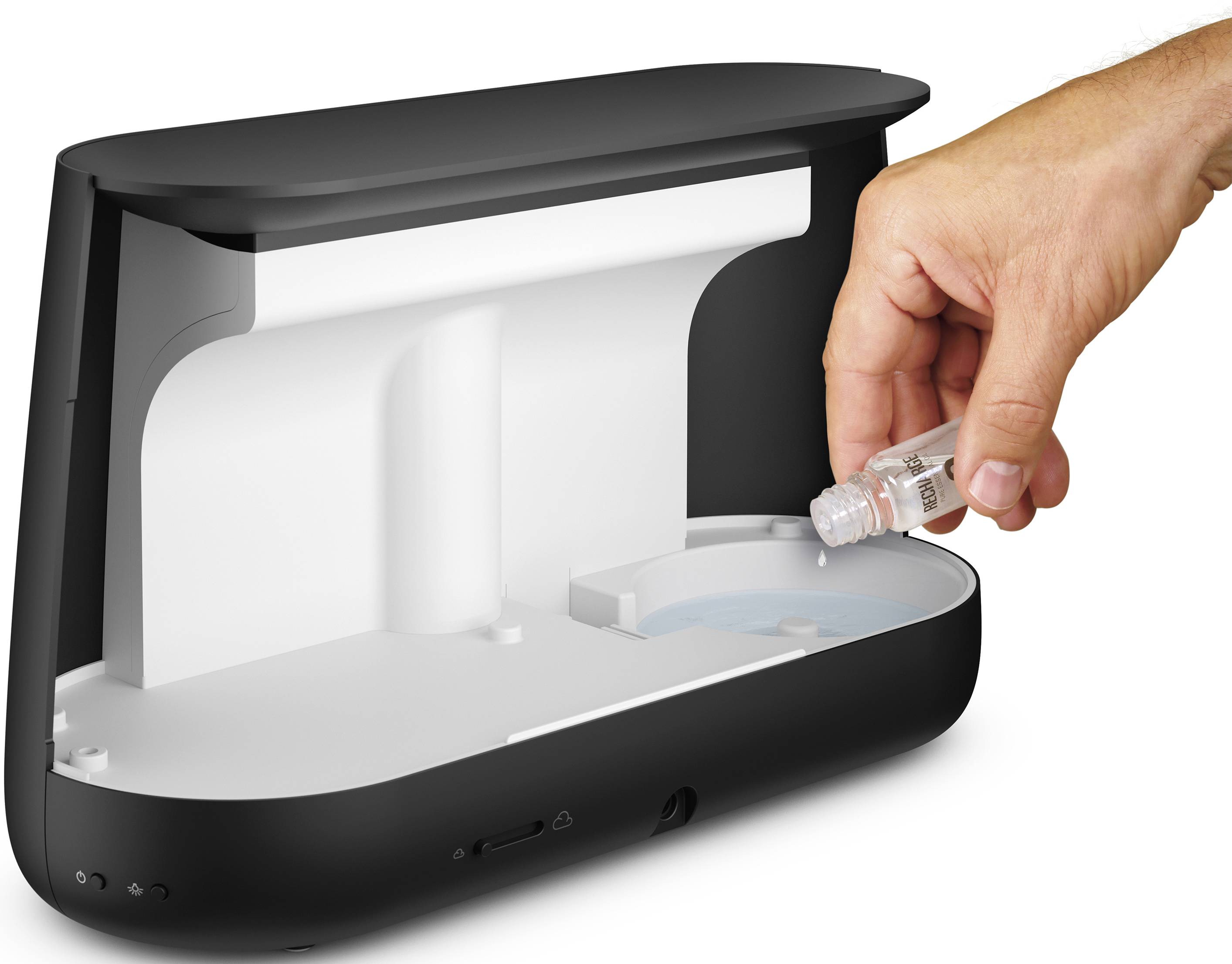 A container is placed into an open sterilisation device. One hand positions the bottle inside the device.