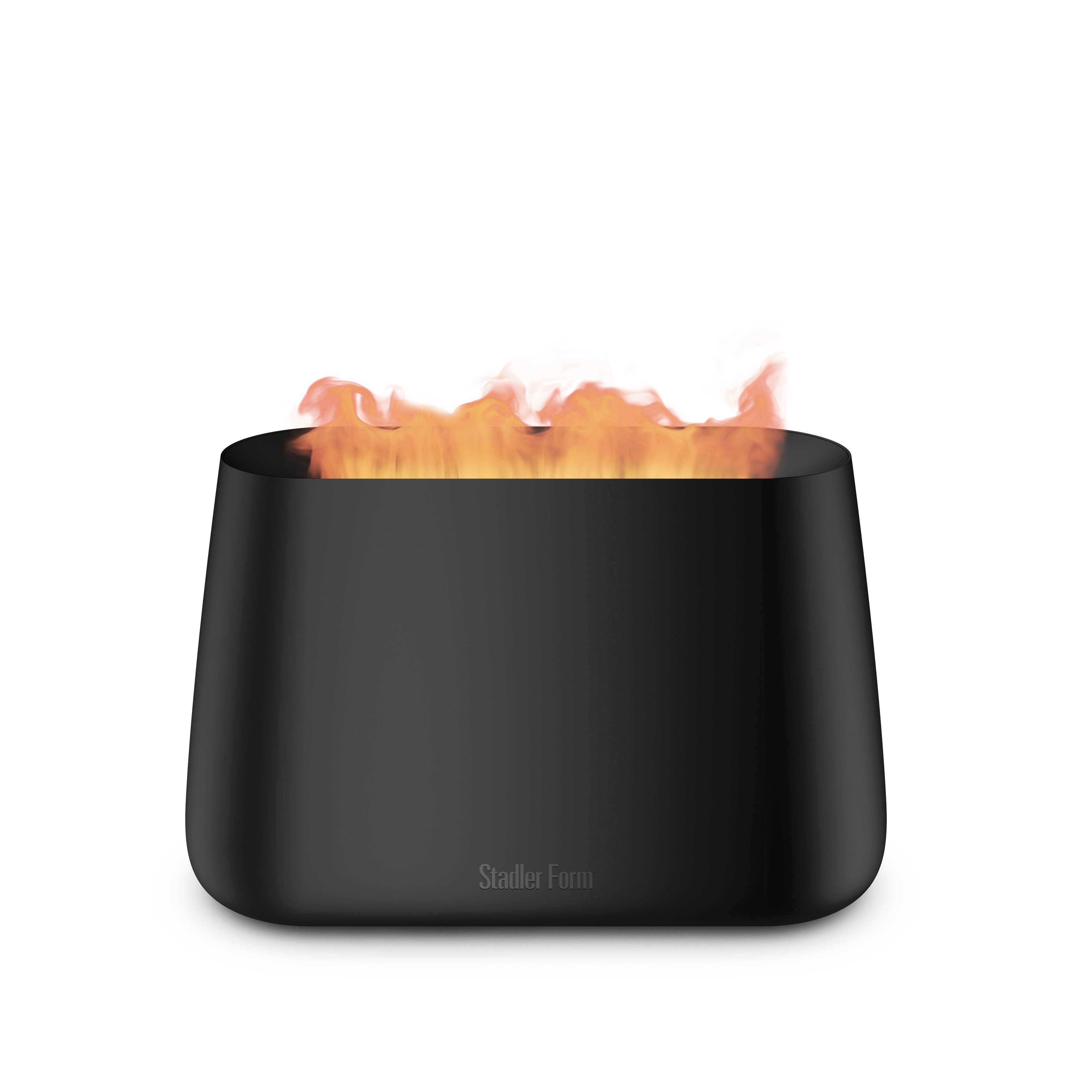 A black, rectangular humidifier with flame effect on the top, by Stadler Form. Perfect for modern interior design.