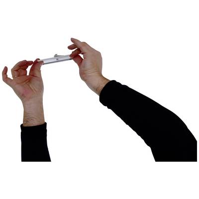 Two hands in black sleeves are holding a small, flat object against a white background.