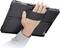 A hand is holding a tablet with a black mount.