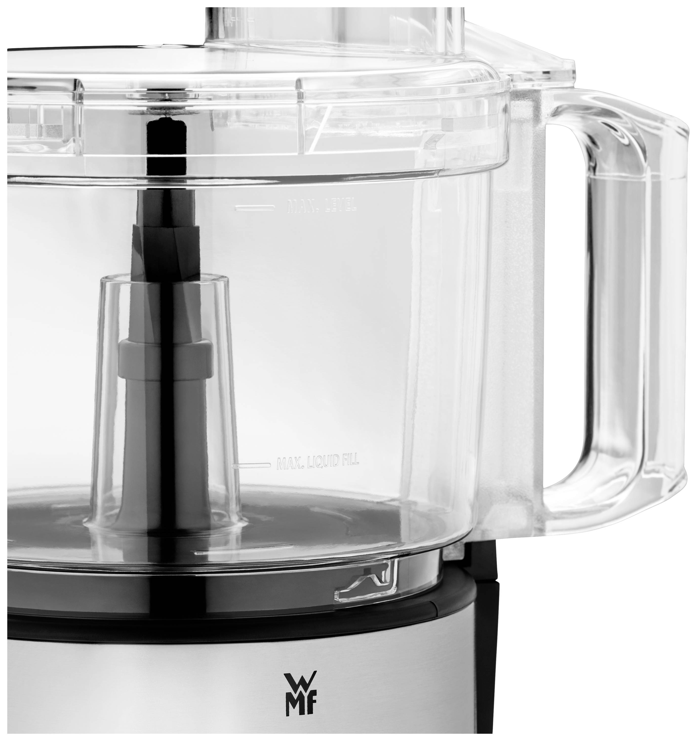 A transparent kitchen machine container with a handle, mounted on a silver base with the 'WMF' logo, shows the maximum fill level.