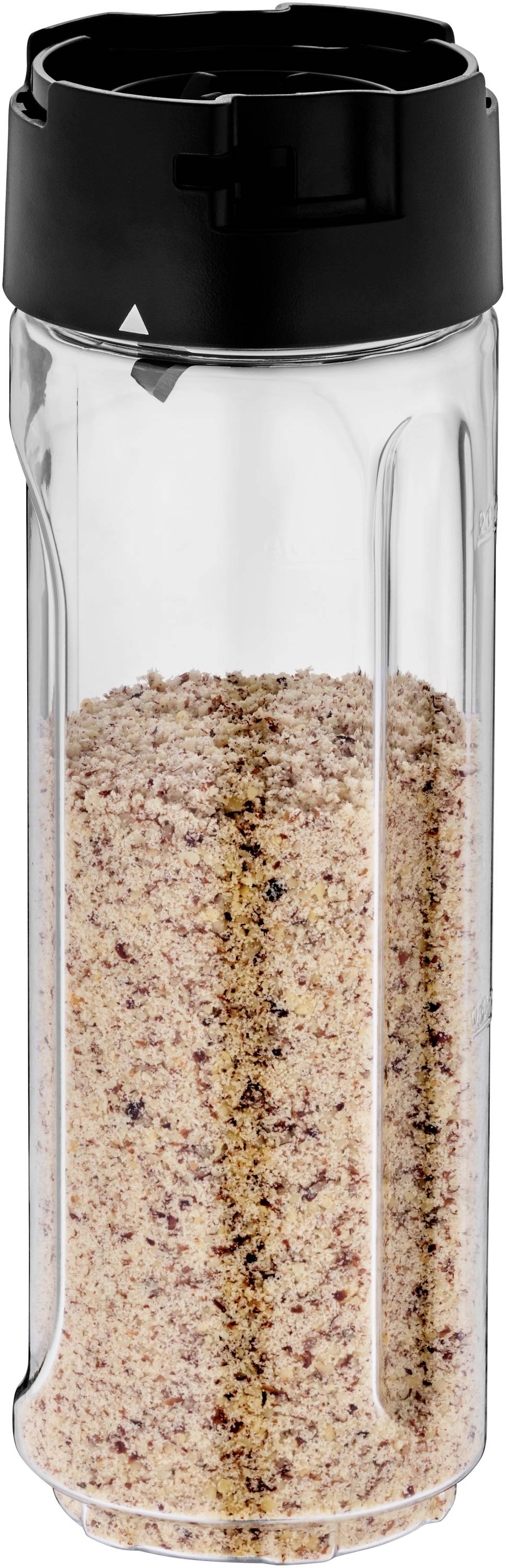 A transparent spice shaker with a black lid, filled with ground spice powder.