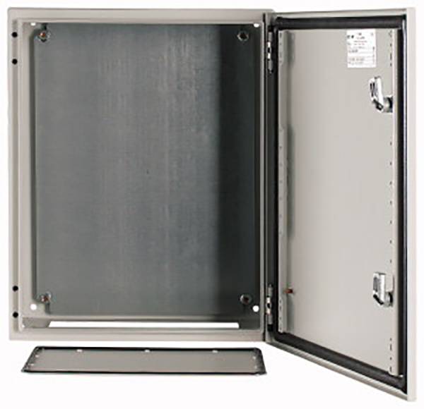 A blank metal electrical enclosure with an open door, suitable for electrical installations, is lying on a white surface.