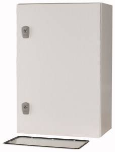A white, rectangular fuse box with two locks and a removable front panel, situated on the floor in front of it.
