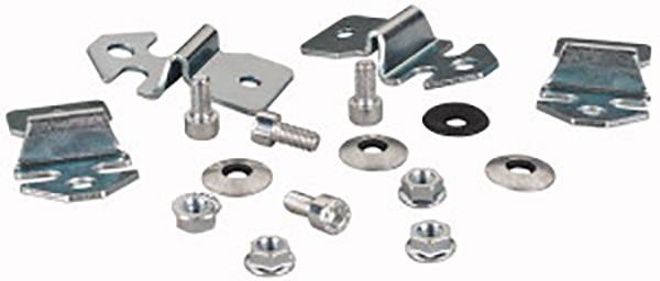 Several metal fastenings, including screws, nuts, and clips, displayed on a white surface.