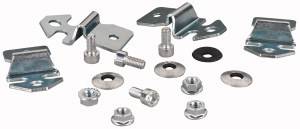 Various metal fixings and screws in different sizes and shapes, arranged on a white background.