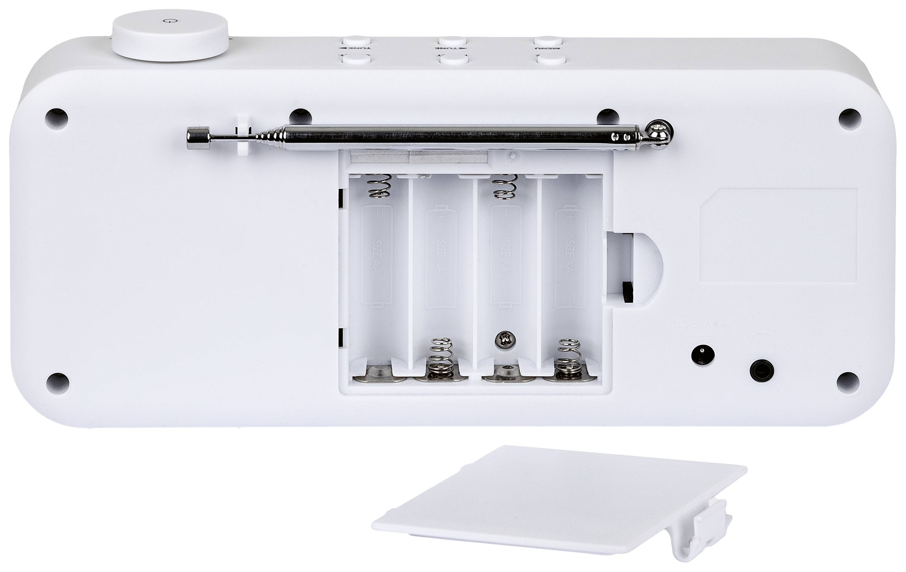 Back of a white device with an open battery compartment that can accommodate four batteries. The cover is lying beside it.