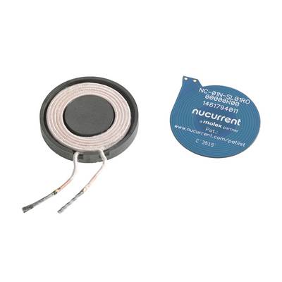 Wireless charging coil and associated circuit board. On the left: round coil with cables. On the right: blue circuit board with markings and text.