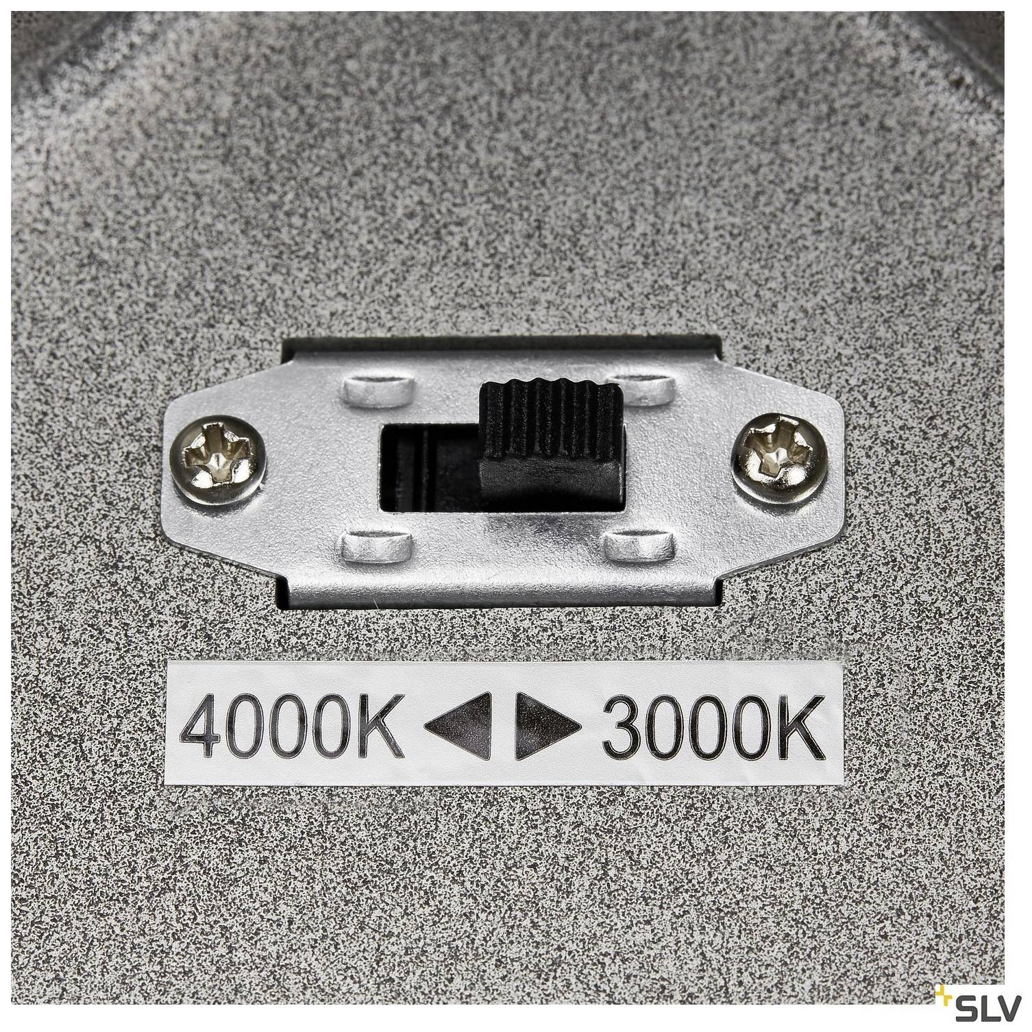 A switch for adjusting the colour temperature between 4000K and 3000K on a metallic casing. Brand logo bottom right.