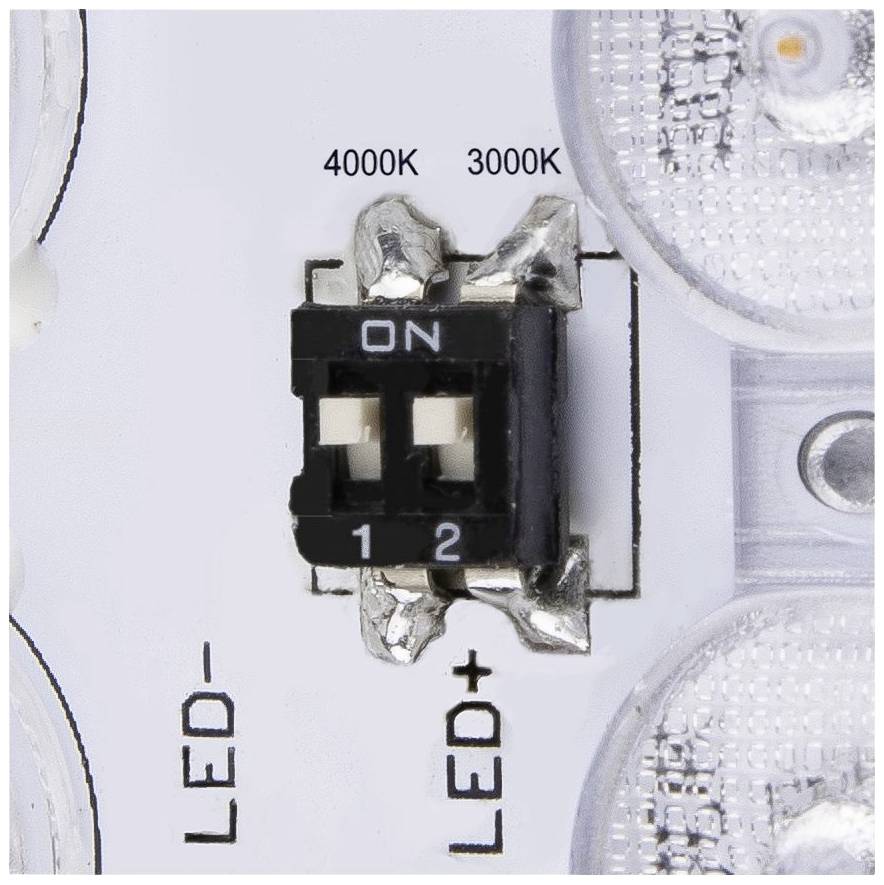 A switch on an LED circuit board with two settings: '4000K' and '3000K'. Markings indicate LED connections, LED- and LED+.